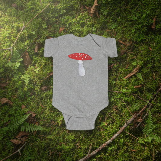 Gray baby onesie with a red and white mushroom design on a white background