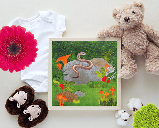 Framed artwork of a nature scene with animals, surrounded by baby items and flowers on a white background.